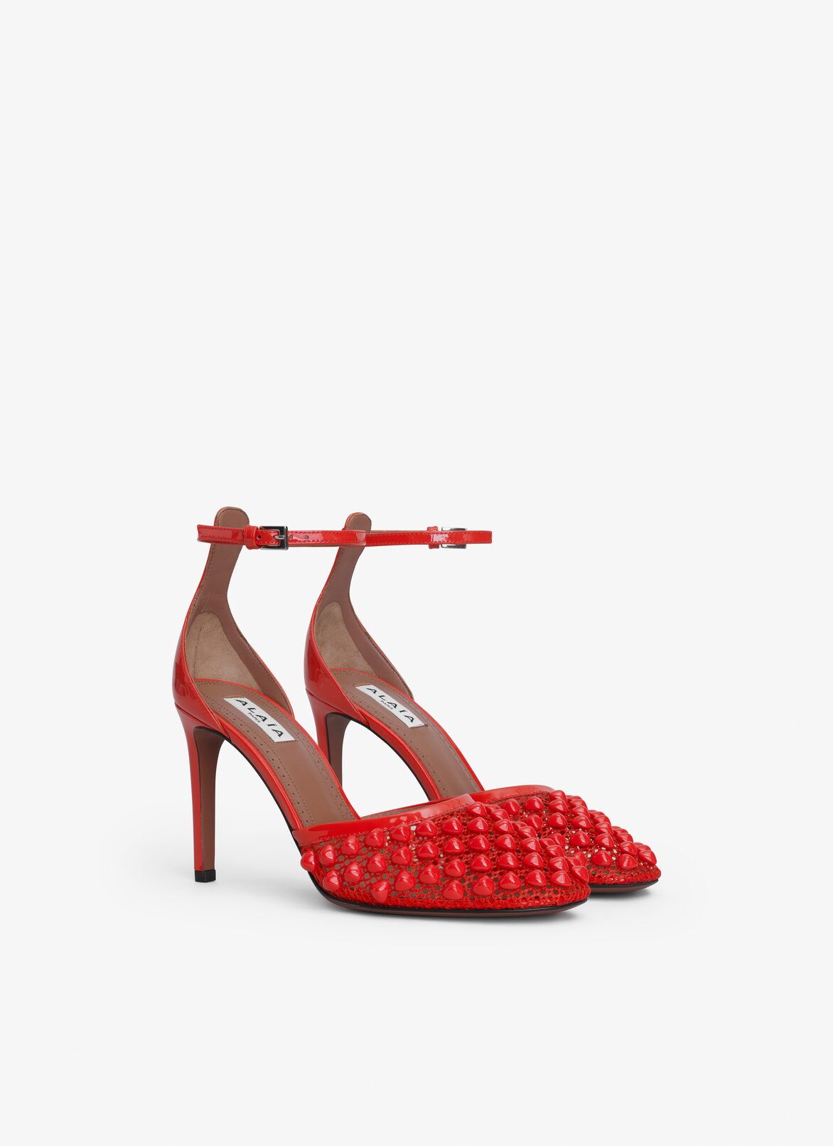 HIGH FISHNET PUMPS WITH STUDS ALAÏA ORANGE HIGH FISHNET PUMPS WITH STUDS